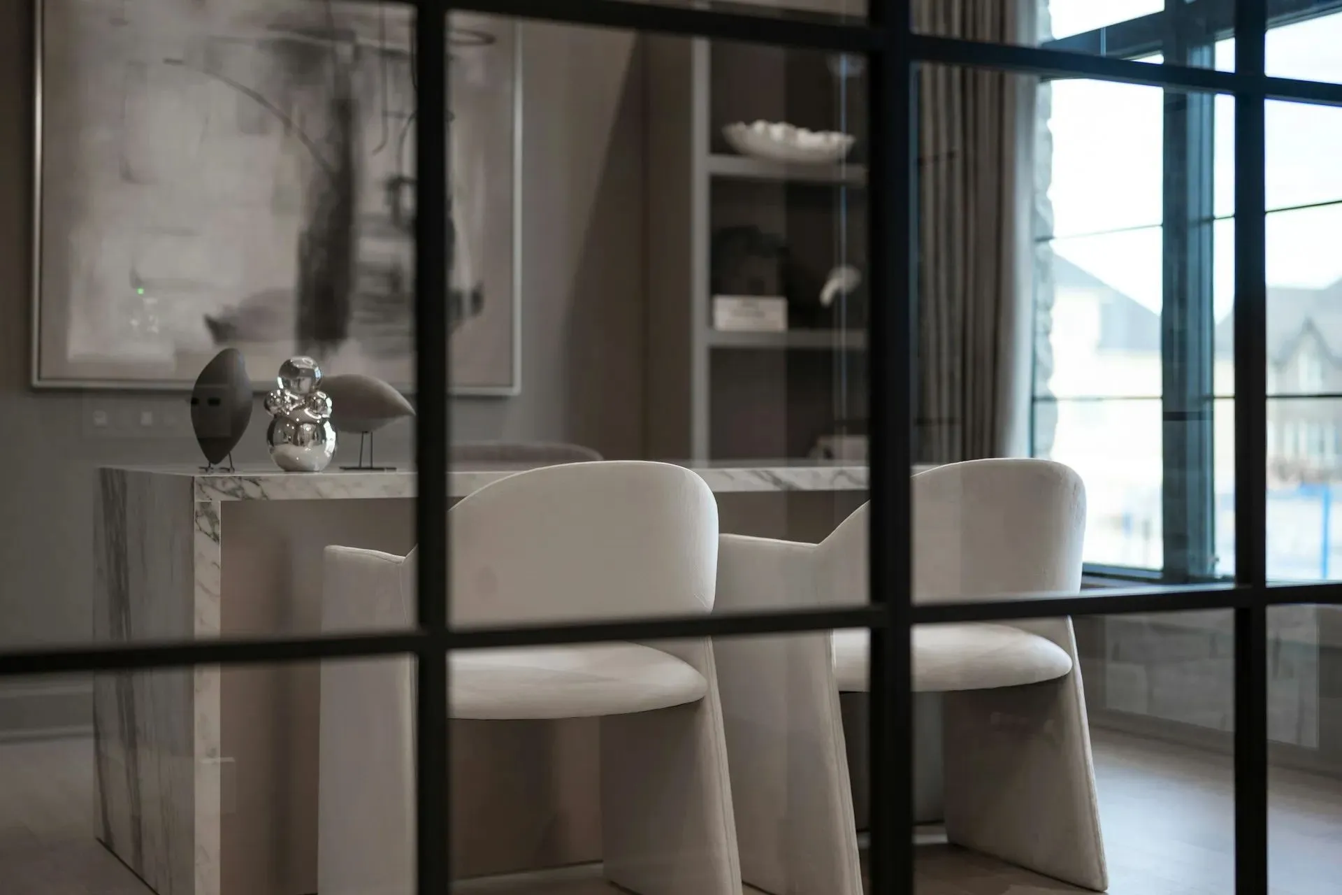 Modern interior viewed through a glass door